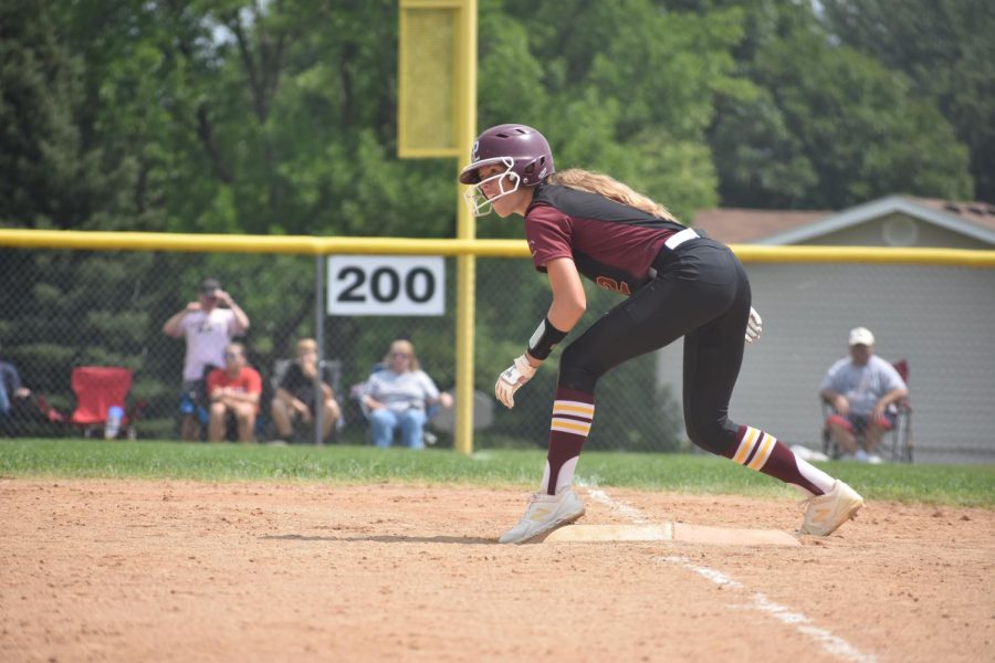 Sophomore Mia Jarecki gets into stance at first base, ready to advance.