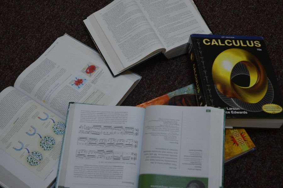 AP class books scattered across the floor of a classroom.