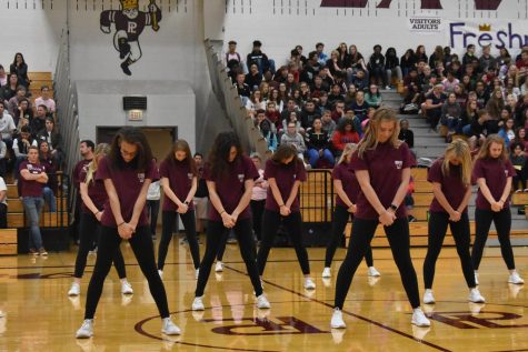 Dance Team getting in stance for their performance at the Homecoming pep rally.