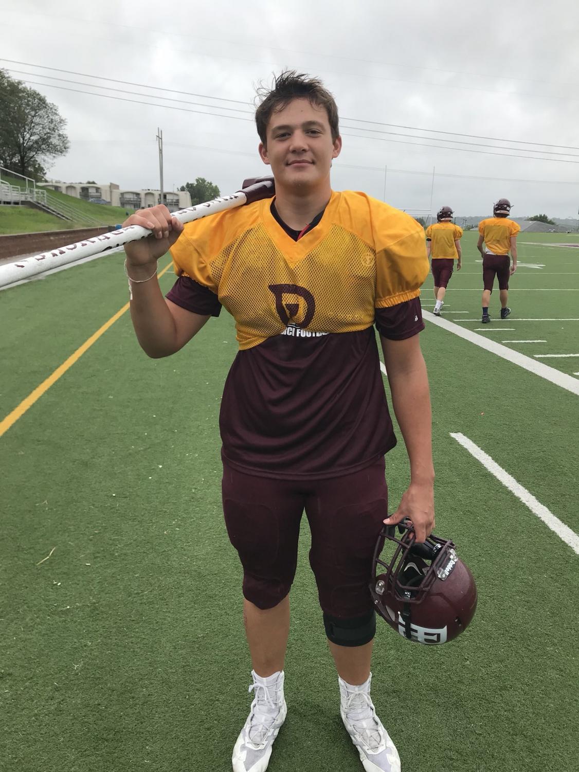 Junior Joe Bianchi holds the hammer with pride after receiving it for the second time.