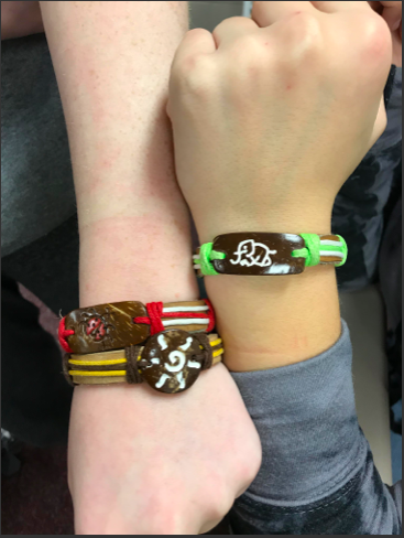 Student council members try on the Yuda Bands when they first come to PLHS.