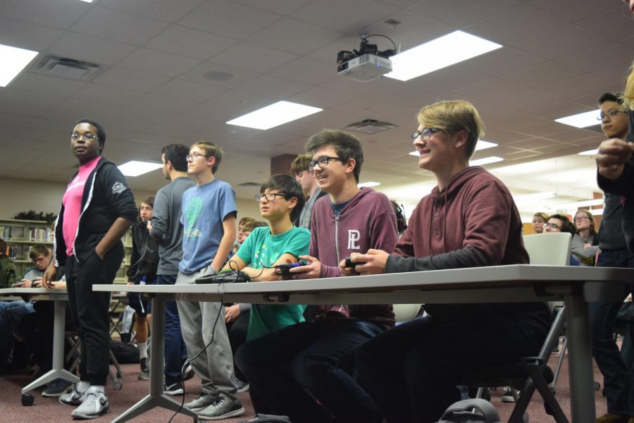 Senior Dylan Rossbach and Sophomore Sebastian MacNabb play a heated battle in the new Smash Bros. game. This was only one of several games that ended in shocked faces and applause.