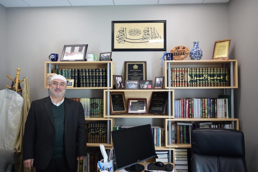 Imam Jamal poses in his office.