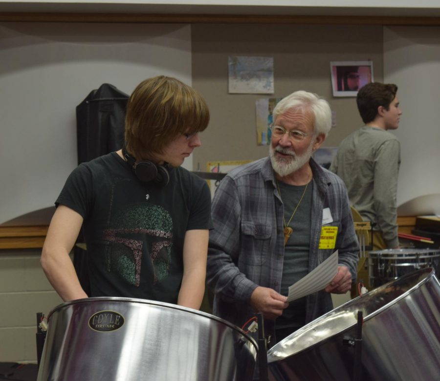 Gulizia works with junior Jake Lumm on the steel drum. The percussion class worked on a piece with various exotic drums.
