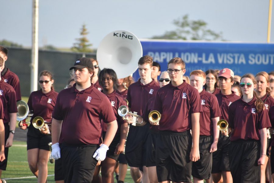 The band marches in parade block towards Foundation Field for the Maroon vs. White scrimmage. 