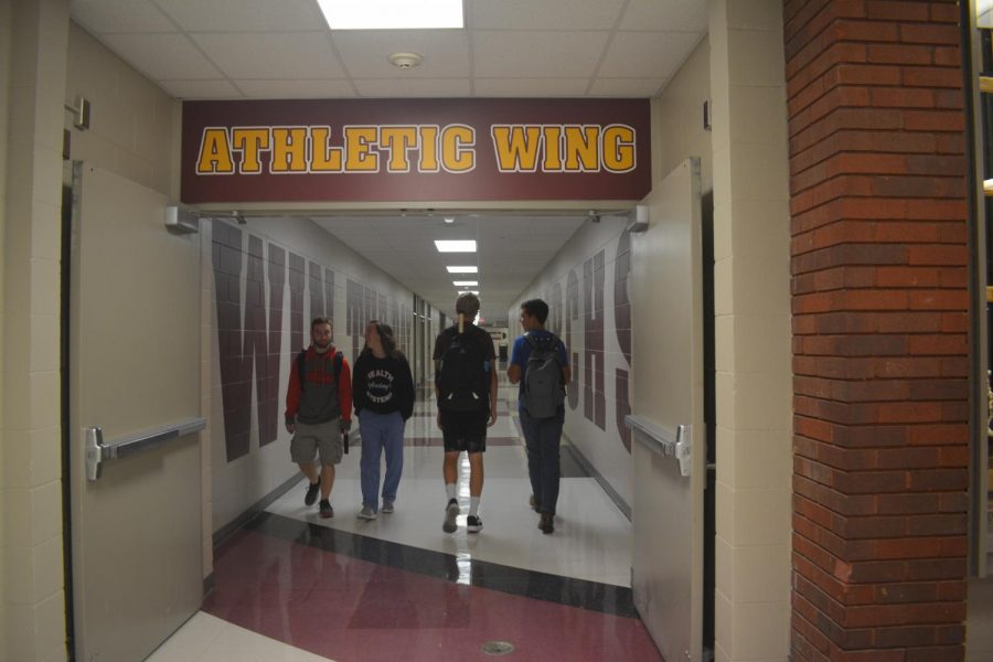 Students enjoy the new artwork and walk down the athletic and fine arts wings.