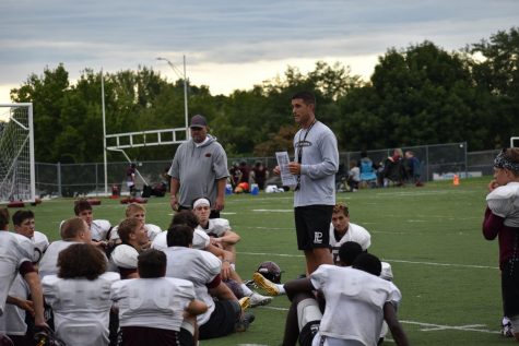 After a morning football  scrimmage at Papillion LaVista High Head Coach Williams addresses the Varsity players on areas of the game that they need to work on. 