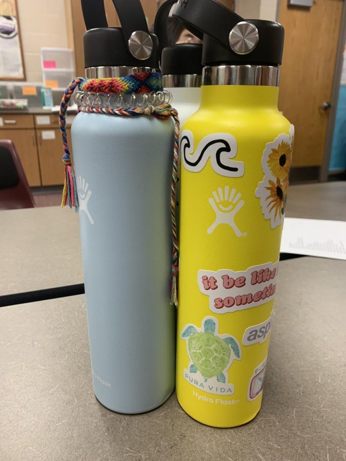 A basic VSCO girl trend is having a Hydro Flask with stickers, hair ties and friendship bracelets attached.