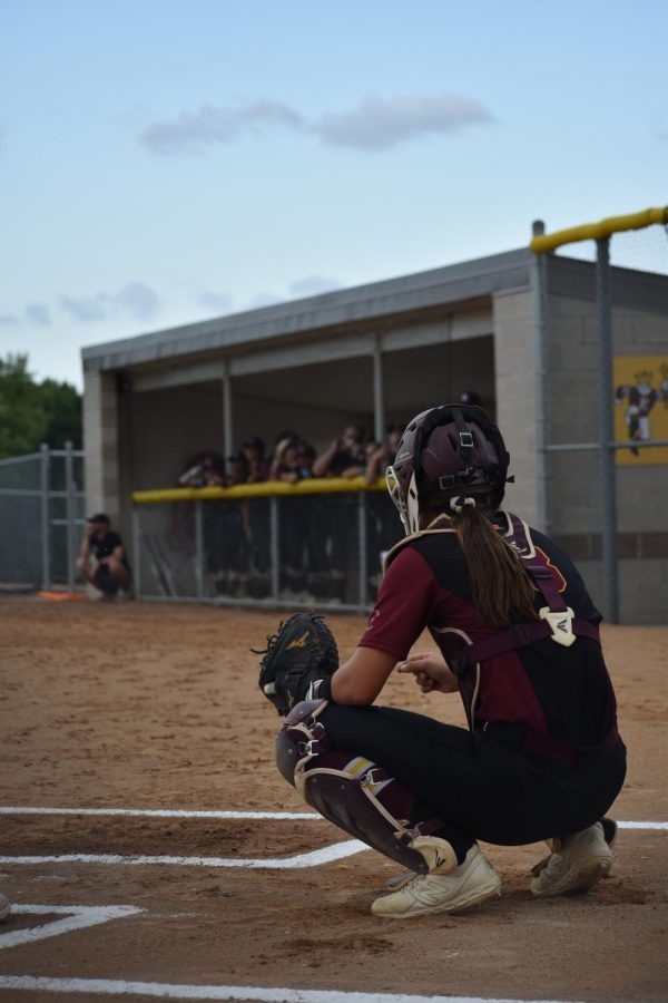 Brooke+Dumont+on+Papillions+home+field+looks+toward+the+dugout+to+receive+signs+to+set+up+for+the+next+pitch.