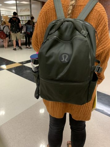 Junior Brenna Armstrong poses with her Lululemon backpack.