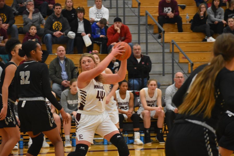 Lindsey Ingwerson protects the ball from her defenders in the 2019 Lincoln Northeast game.
