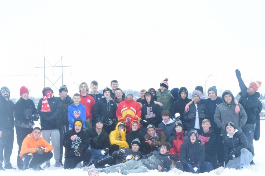 The wrestling team enjoys a fun bonding day in the snow. 