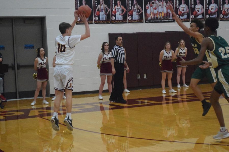Sophomore guard Keegan Hylok shoots a three against Bryan Tuesday night. Every Monarch got to play in this 35 point win