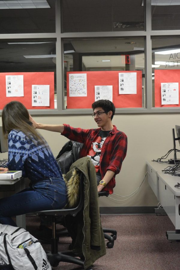 Junior Micheal Theede enthusiastically points as he shares his opinion on political topics. He discussed the possible repercussions of WWIII