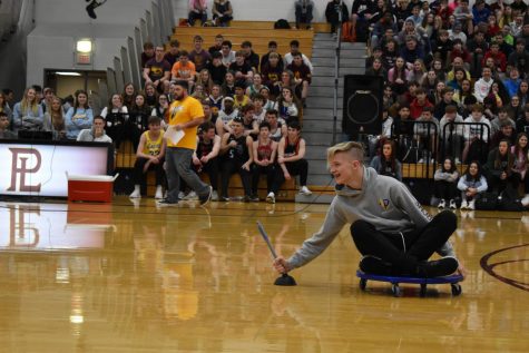 Sophomore Jacob McGrew stuggles to move on a scooter after one of his teams plugers broke.