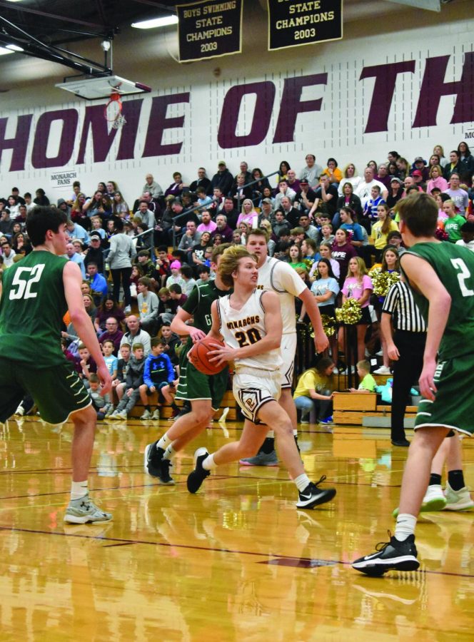 Junior Joey Hylok drives through defenders for a lay-up.