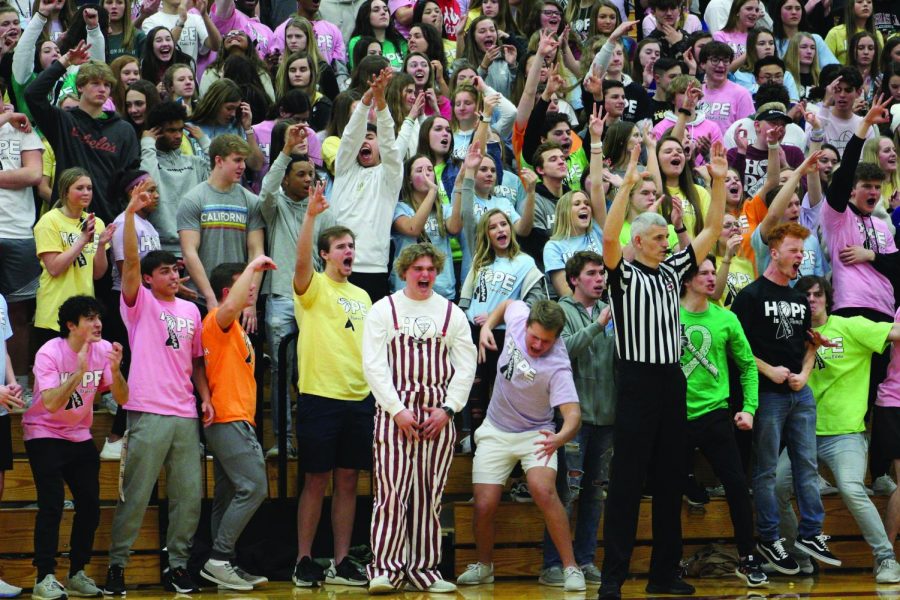 The Monarch student section show out during the color of hope game and cheer for the boys team.