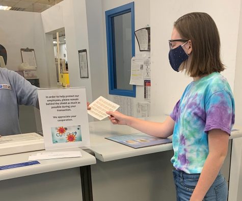 Sophomore Meredith Koehler purchases stamps from a local USPS.