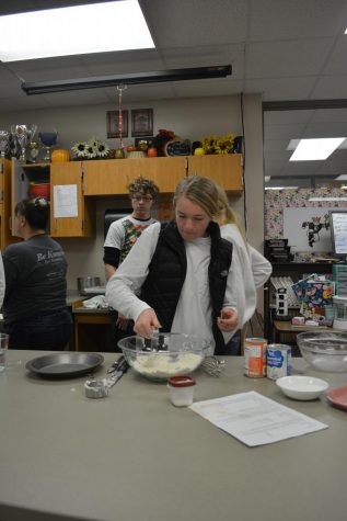 A student baking in Culinary Club. Many students have picked up cooking over quarantine.