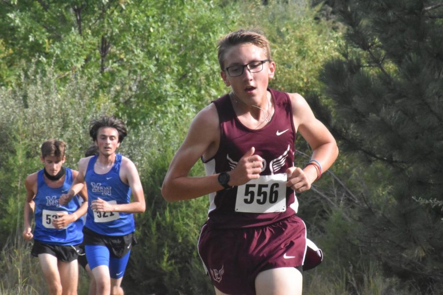 Sophomore Sam Thompson fights his way up a hill Saturday. He finished with a 18:43 5k, beating his personal best by three seconds