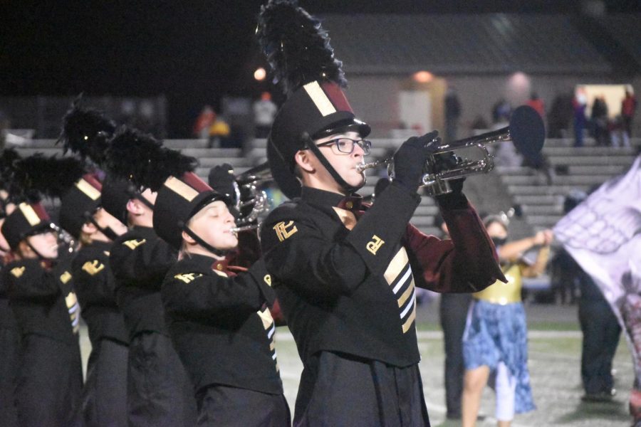 The marching band performs at halftime last season.