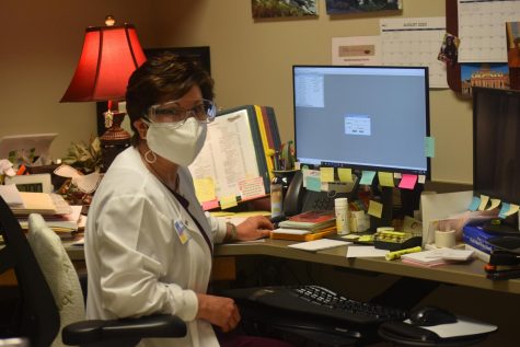 Nurse Jeanes works through the pandemic in her office.