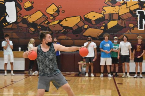 Junior Parker Wolfe aims to throw the dodgeball at the opposing team.