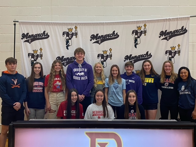 The+seniors+celebrate+their+commitment+to+play+collegiate+sports.+They+signed+their+letter+of+intent+on+November+10th.