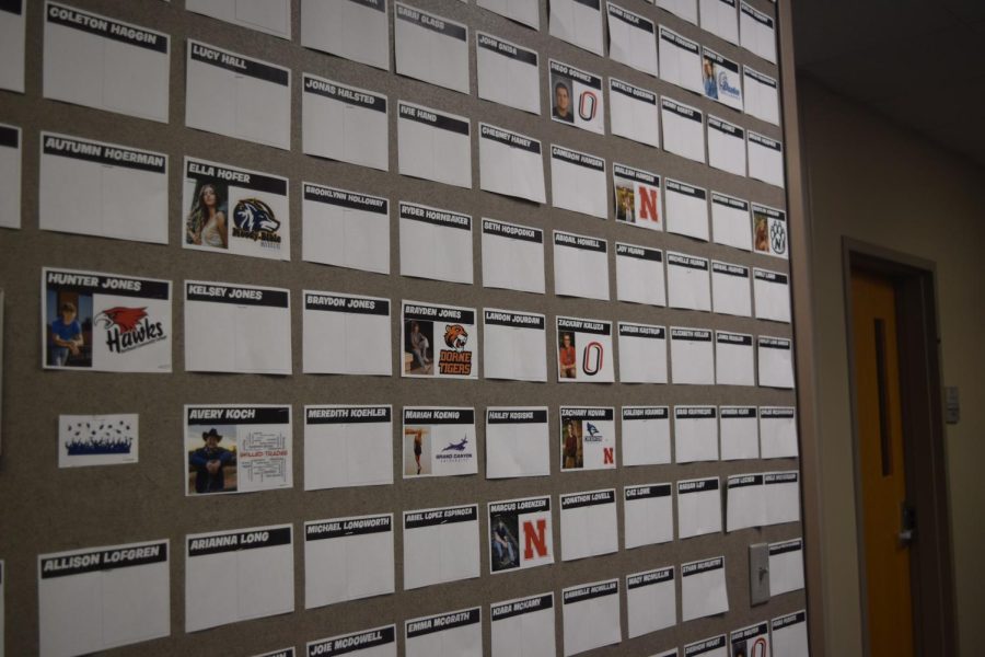 A wall in the counseling center shows the college choices of seniors. 