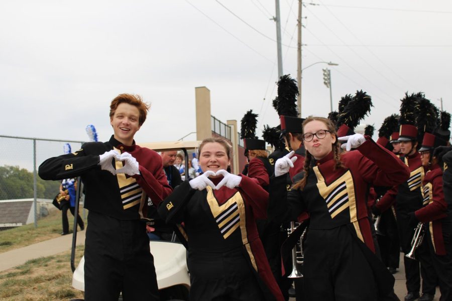 Drum majors Meredith Koehler, Cassidy Welsh, and Hudson Carrico strike a pose during downtime at the Star Fest contest.
