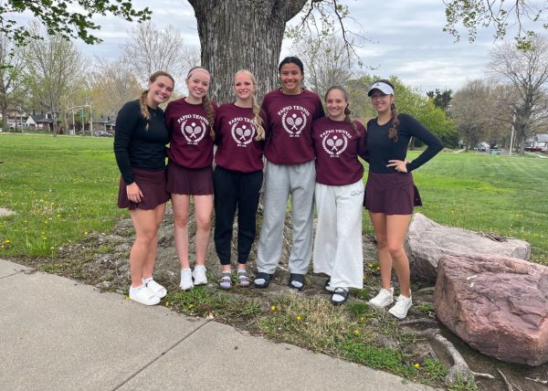 The PLHS tennis invite competitors pose in front of their winning tree at Woods Tennis Center in Lincoln.