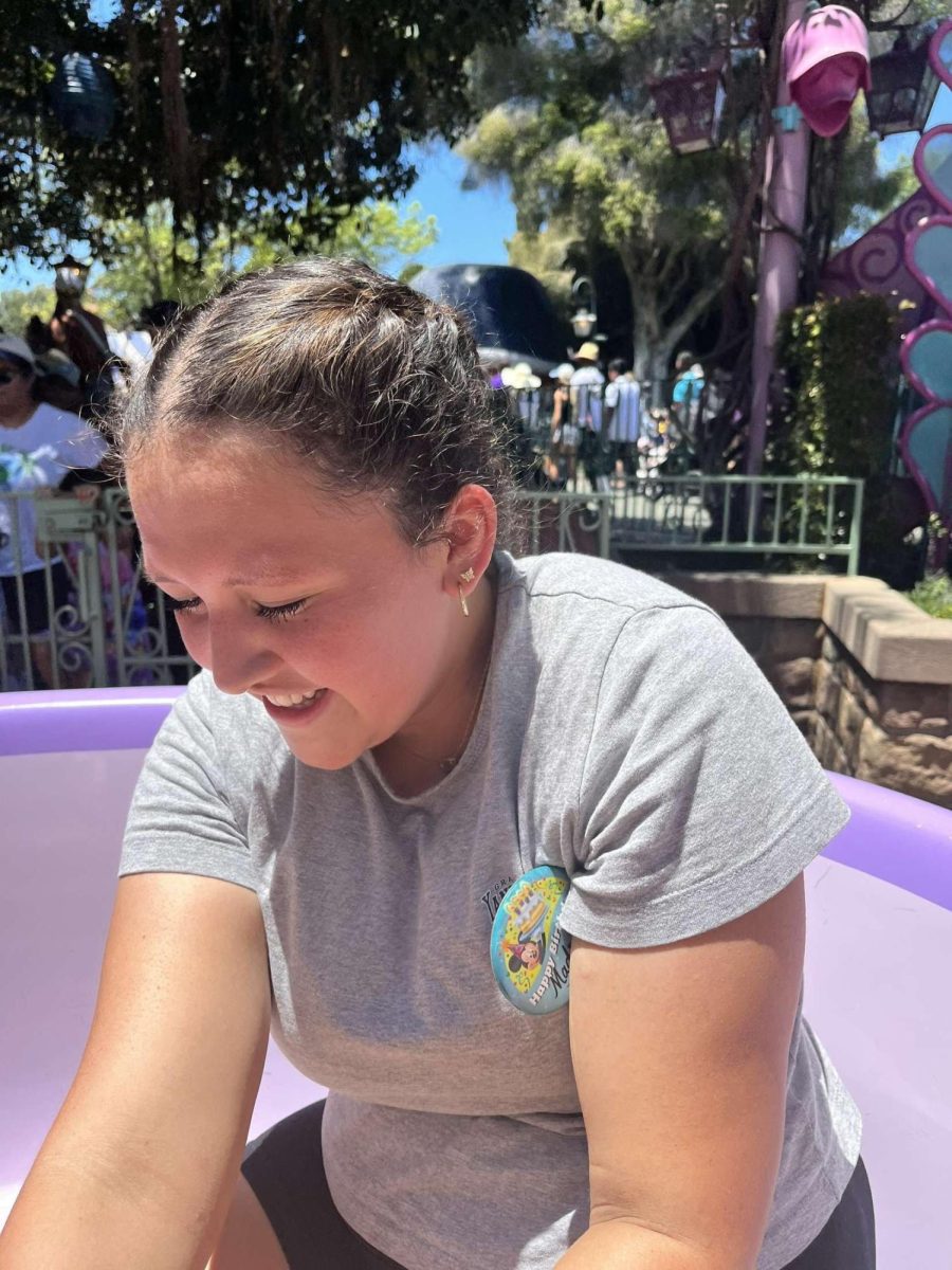 Junior Madison Perez riding the Alice and Wonderland ride at Disneyland California last summer. 
