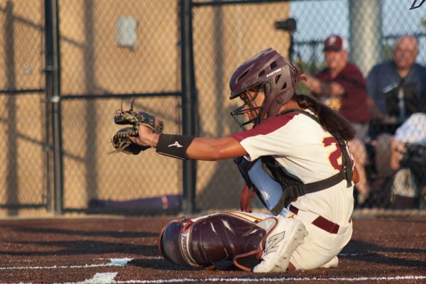 Catcher Toria Rother frames the pitch in the Monarch Softball 9-3 win against Elkhorn South on August 27. 