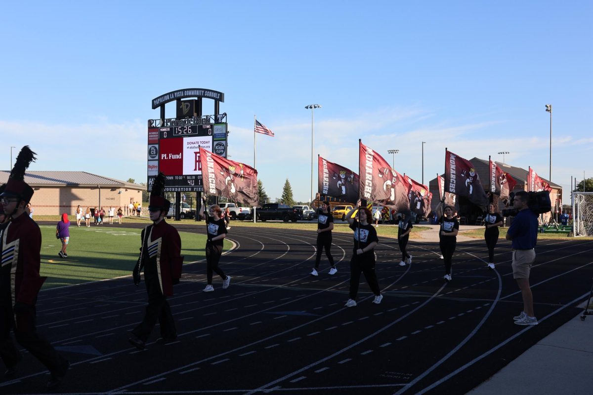 Color Guard marches at the Papio South game.