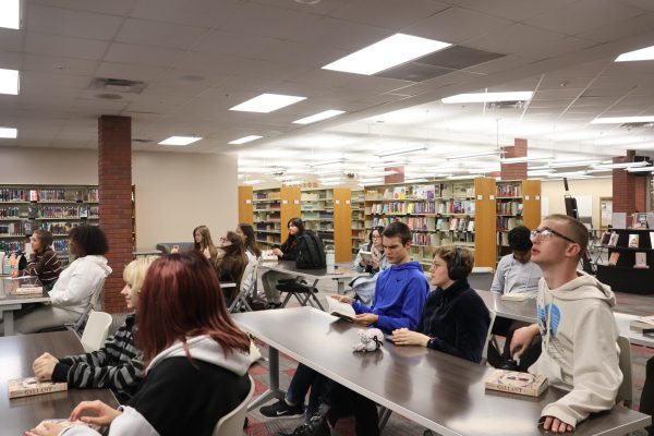 Students sit and discuss the first section of Gallant.