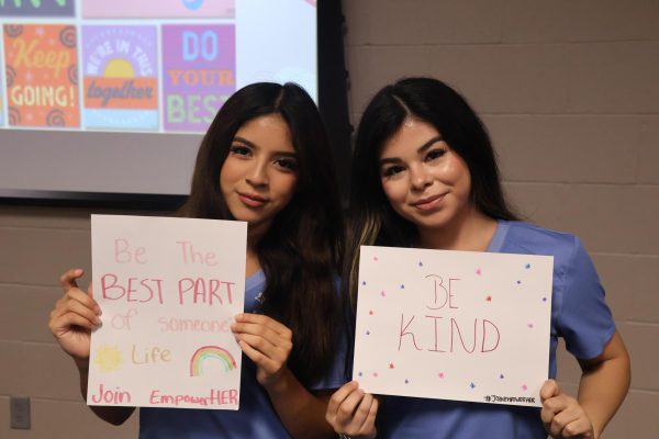 Seniors Arianna Ruiz and Leslie Espinoza showing off their posters with a positive message.