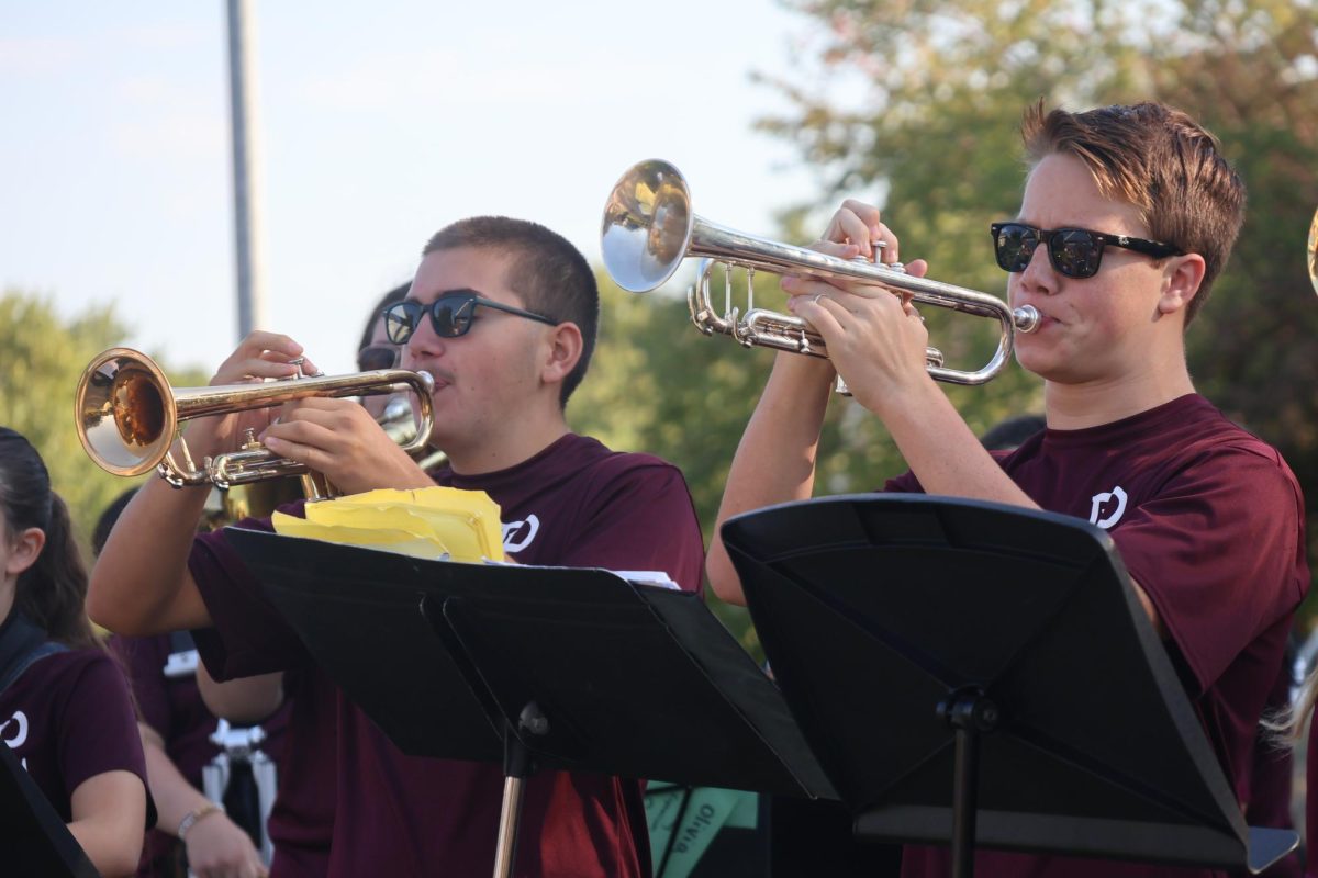Marco Silva and Isaac Morrissey play the trumpets during the Band Lawn Concerts Aug 23, 2025.