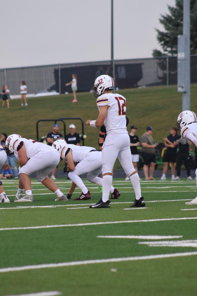 Junior quarterback RJ Vitera prepares to get the ball in the Monarch's first game of the season.