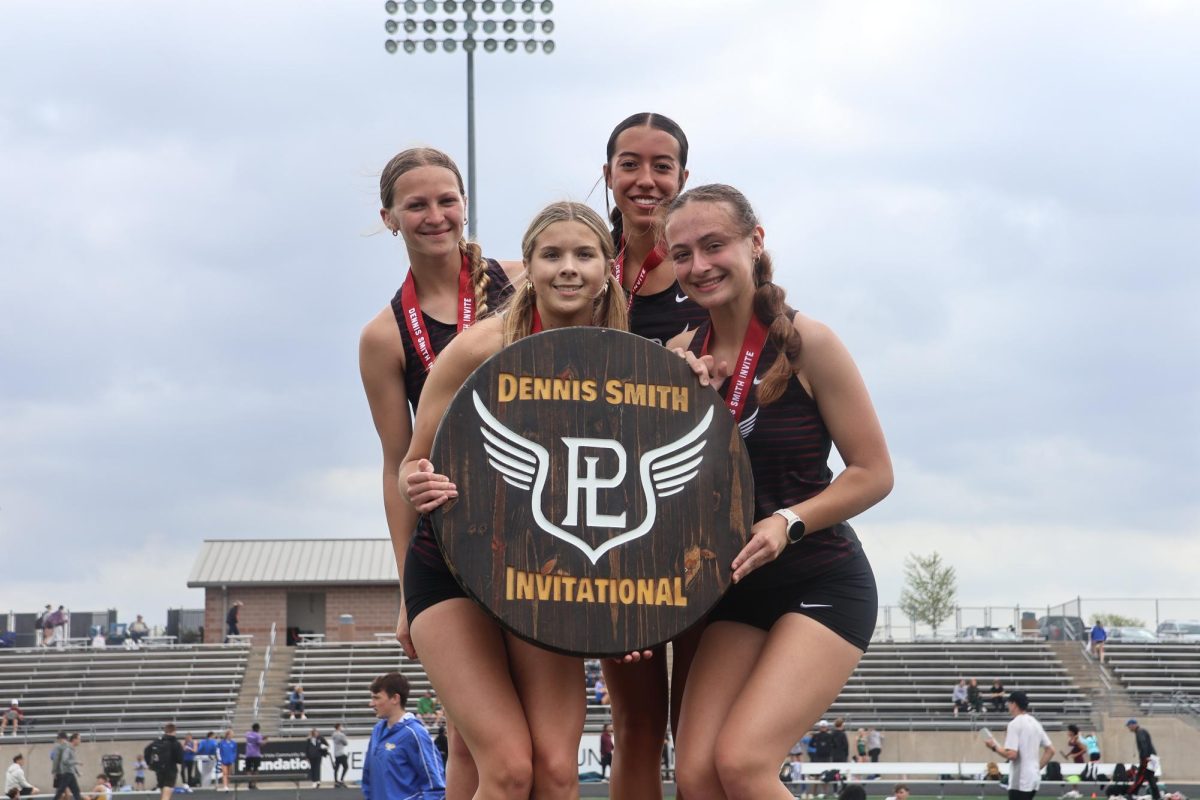 The girls 4x800m team takes 1st place at the Dennis Smith Invite at Papillion South High School. The team finished with a final time of 9:32:35.