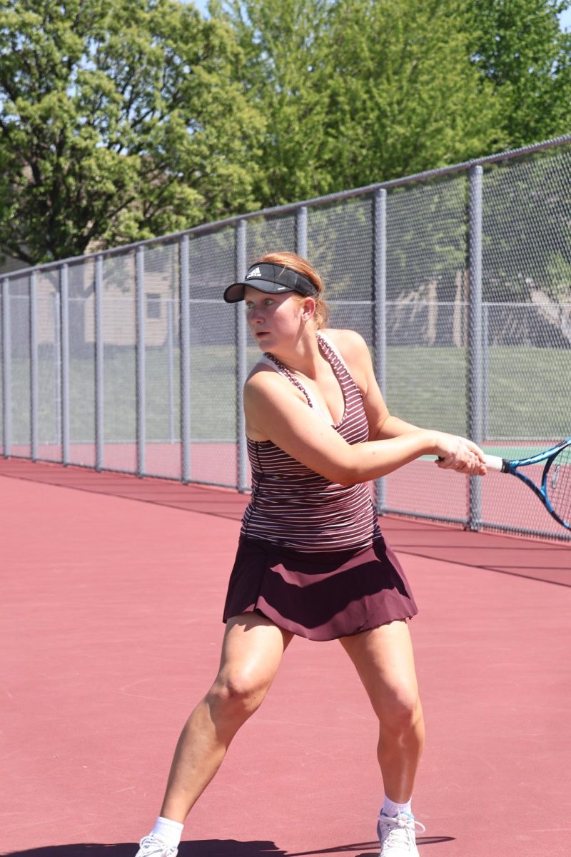 Sophomore Claire Eitzen prepares to hit a backhand return.